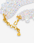 Alana Cloud necklace featuring multiple strands of translucent bubble shapes with rainbow iridescent reflections.