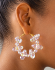 Sassy Jones Alana Cloud earrings featuring playful iridescent bubble clusters arranged around oversized hoops.