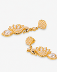 Ornate swan dangle earrings featuring shimmering crystals, creamy pearl accents, and graceful gold sculptural detailing.