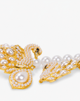 Gold swan statement necklace embellished with sparkling crystals, ivory pearl accents, and an elegant double swan centerpiece.