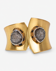 Armana Statement Hinge Cuff in black featuring an oversized dark stone centerpiece and Gold tone finish.