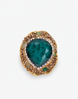 Armana Statement Ring in Emerald featuring an oversized green stone centerpiece with sparkling crystal accents.