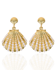 Gold shell dangle earrings featuring luminous pearl embellishments and coastal-inspired detailing by Sassy Jones.