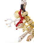 Statement charm necklace featuring pearl-studded shell pendants, coral accents, starfish charms, seashell details, pavé crystal elements, and gold-tone hardware by Sassy Jones.