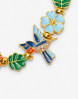 Cherish Hummingbird 18k Garden Stretch Bracelet displayed against a white background with colorful birds and floral details.