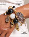 Black and gold statement bracelet featuring chunky round beads, natural agate, and dangling bead clusters.