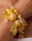 Two piece yellow stretch bracelet stack featuring a large natural agate centerpiece and coordinating beadwork.