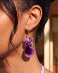 Chrysallis Grape Jelly purple natural agate dangle earrings featuring polished agate slice drops, clustered purple faceted beads and gold tone fish hook closures.