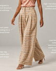 Full-length view of The Claire Tweed Wide-Leg Trouser with structured waistband, side pockets, and flowing wide legs.