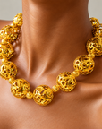 Dina Sculptural Globe Chain Gold featuring oversized openwork gold sphere beads.