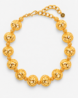 Dina Sculptural Globe Chain Gold featuring oversized openwork gold sphere beads.