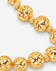 Dina Sculptural Globe Chain Gold featuring oversized openwork gold sphere beads.