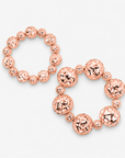 Dina Rose Gold 2 Piece Stretch Bracelet Stack featuring oversized and petite openwork sculptural spheres.