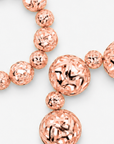 Dina Rose Gold 2 Piece Stretch Bracelet Stack featuring oversized and petite openwork sculptural spheres.