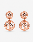 Rose gold statement earrings featuring a petite textured sphere and larger sculptural globe.