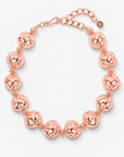 Dina Sculptural Globe Chain Rose Gold featuring oversized openwork sphere beads and smaller textured spacers.
