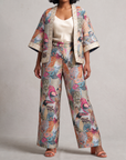 Multicolor jacquard jacket featuring detailed birds and decorative gold embroidered borders along the front, sleeves and hem.
