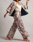Fawna Jacquard Embroidered Pants featuring an intricate multicolor bird design and ornate gold embroidered trim on front pocket.