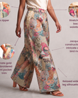 Multicolor jacquard wide leg pants featuring detailed birds and decorative gold embroidered borders along the front pocket.
Fawna statement