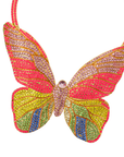Statement butterfly bib necklace featuring vibrant multicolored crystals in coral, pink, gold, turquoise, and emerald with gold tone detailing.