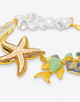 Harbor Grace 18k Anchor Necklace featuring luminous baroque pearls and colorful nautical statement charms.