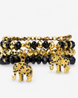 Ibiza 4pc Stretch Bracelet Stack in Black and Gold featuring faceted beads and elephant charms.