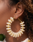 Kamaria Ivory Coast statement necklace with layered ivory coconut shell pieces and mixed dimensional beads.