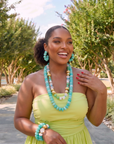 Kamaria Riviera Teal jewelry trio featuring vibrant turquoise beads with clear and gold colored accents.