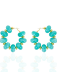 Teal statement hoop earrings featuring oversized marbled turquoise beads and gold-tone accents by Sassy Jones.