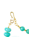 Layered teal statement necklace featuring marbled turquoise beads, frosted sea-glass inspired accents, and gold-tone details by Sassy Jones.