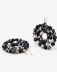 Oversized black and white statement earrings made with dimensional textile covered beads.