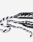 Kenza black and white statement necklace with layered textile beads and graphic monochrome pattern.