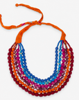 Kenza Cloth Bead Bib in multicolor featuring layered strands of vibrant fabric wrapped beads.