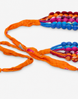 1. Kenza multicolor statement necklace with layered cloth beads in vibrant jewel and citrus inspired shades.