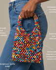 Sassy Jones Kenza tote featuring colorful textile wrapped beads across the body and rounded handles.