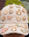 Tan distressed denim ballcap featuring removable butterfly, ladybug, heart, and floral crystal brooch pins by Sassy Jones.
