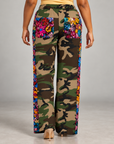 Women's wide leg camouflage track pants with vibrant blue, pink, red and orange sequin detailing.