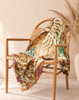 Artistic square fashion scarf featuring a regal woman's side profile surrounded by an ornate antique inspired gold frame.