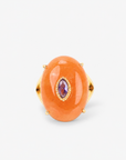 Samira Natural Stone Ring in Orange featuring an oversized smooth orange stone with purple center accent.