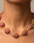 Scarlette Dainty Pearl Chain arranged in a circle showing linked jeweled ladybugs and adjustable chain closure.
