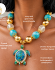 Chunky coastal statement necklace featuring oversized beads and a blue and green enamel sea turtle pendant.