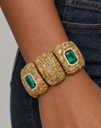 Sassy Jones Soraya Luxe Bracelet featuring rich green accents surrounded by warm metallic crystal embellishments.