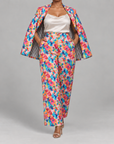 Sassy Jones multicolor floral trousers featuring a flowing wide leg silhouette and functional side pockets.
