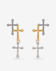 Trinity 18K Cross Sparkling Earrings featuring three cascading crystal crosses in gold and silver finishes. Woman wearing Trinity statement earrings with layered gold and silver crystal cross motifs. Sassy Jones Trinity drop earrings featuring three sparkling crosses in contrasting mixed metal finishes. Close up of crystal cross earrings with a silver cross stud, gold center cross and dangling silver cross. Trinity faith inspired earrings featuring cascading crystal embellished crosses in gold and s