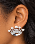 Silver colored crown earrings featuring graduated pearl accents and shimmering crystal embellishments.