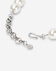 Vintage inspired statement necklace featuring luminous ivory pearl beads and an embellished cream necktie.