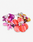 Colorful floral statement bracelet featuring iridescent pink abalone shell flowers, freshwater cultured pearls and dimensional bead details.