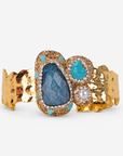 Zahara Adjustable Cuff in Blue featuring deep blue and teal stones surrounded by sparkling crystal accents.