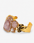 Rose statement cuff featuring soft pink stones, a pearl accent and textured Gold tone finish.