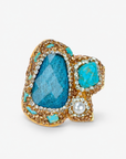 Zahara Sparkle Ring in Blue featuring a deep blue centerpiece with teal stones, pearl and crystal accents.